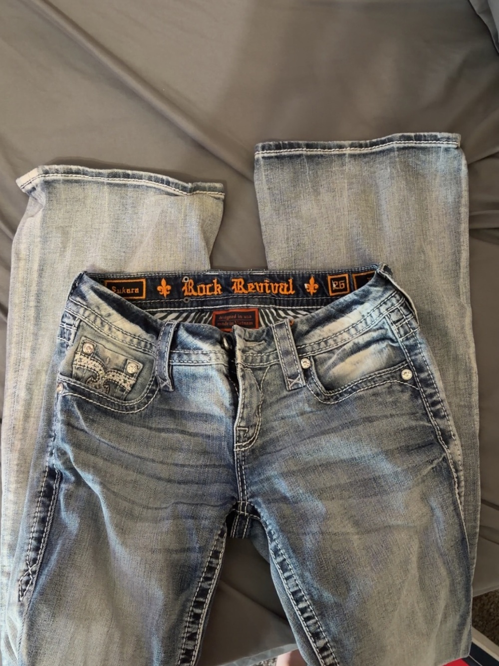 Rock Revival Distressed Light Blue Jeans with Orange Embroidery